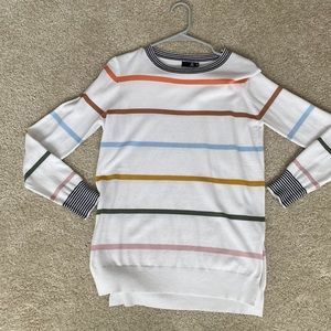 & white sweater with colored stripes